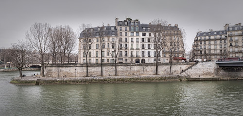 View from the Quai de Bourbon on the Pont Saint-Louis, Quai aux Fleurs and Seine River. France....