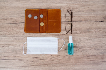 The purse has coin overlaid and masks placed on the office desk