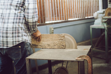 Young wood designer working in workshop