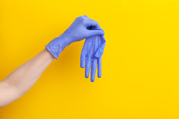 Step-by-step instructions on how to remove dirty gloves, doctor take off from hand glove
