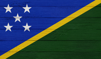 Solomon Islands flag on a wooden texture. Wood texture, planks Wooden texture background flag. Flag...