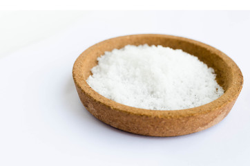 Fototapeta na wymiar salt on a black background,salt on wooden spoon isolated on white background,A pile of coarse salt on a black background