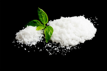  salt on a black background,salt on wooden spoon isolated on white background,A pile of coarse salt on a black background