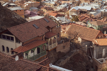 Panorama of the city of Tbilisi from a high point. Tiled roofs of old houses. View of the old city.