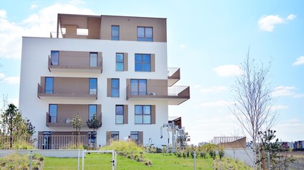 Modern apartment building on a sunny day with a blue sky. Facade of a modern apartment.