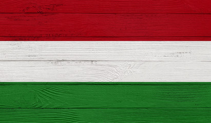 Hungary flag on a wooden texture. Wood texture, planks Wooden texture background flag. Flag painted with paints on wood
