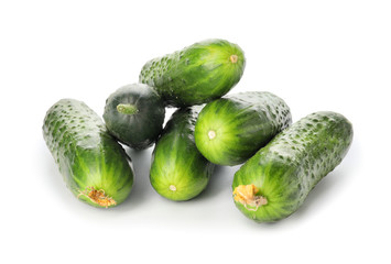 Green cucumbers on white background