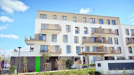 Modern apartment building on a sunny day with a blue sky. Facade of a modern apartment.