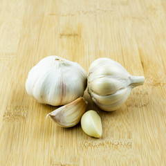 Garlic isolated on wood background