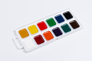 Palette of watercolors on white background. Paints for drawing.