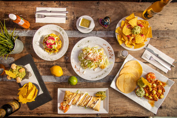 overhead shot of mexican food on wooden table