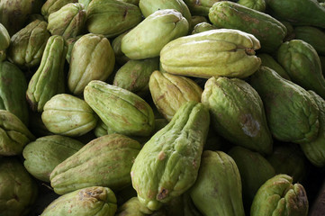 Organic Chayote fruits for sale in the traditional market. Chayote (Sechium edule) is an edible plant