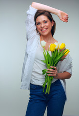 Smiling woman holding flowers isolated portrait