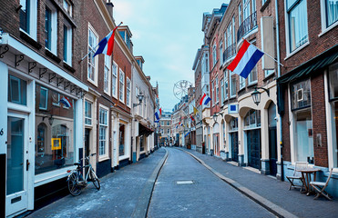 Brick houses with flags of the Netherlands in The Hague.