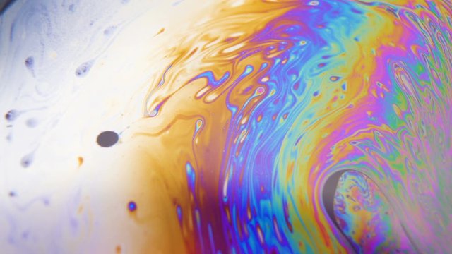 Vibrant multicolored rainbow fluid moving around. Subconscious concept. Relaxation background