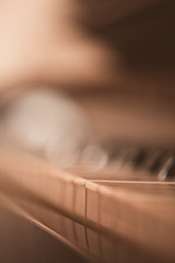 Old vintage piano closeup with focus on keys.