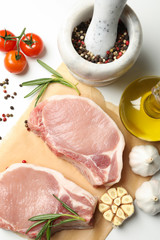 Composition with raw meat and ingredients on white background, top view