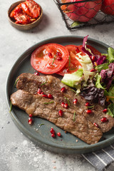 Grilled beef with  tomato and salad