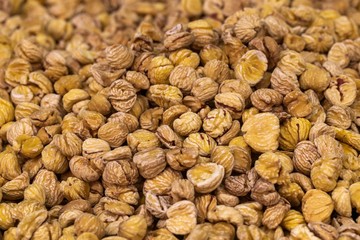 Sweet dried chestnuts closeup, background of dried chestnuts, street food market