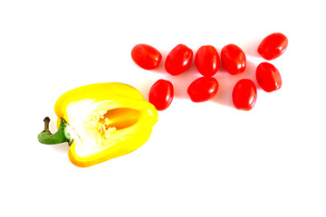 Yellow pepper and cherry tomatoes on a white background. Suitable for advertising background.