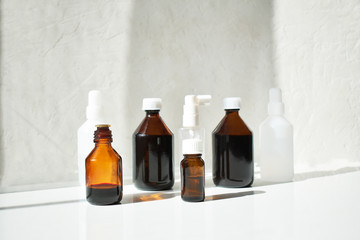 Various medical jars with medicinal potions on a white background.
