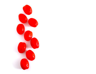 Small blush tomatoes on a white background. Suitable for advertising background.
