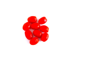 Small blush tomatoes on a white background. Suitable for advertising background.