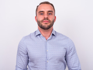 Portrait of bearded businessman looking at camera
