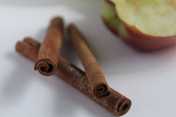 cinnamon sticks are on the table on a white background there is a place to insert text