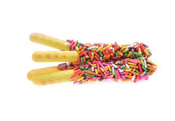 Biscuit stick bread with sweet colorful chocolate isolated on white background