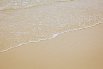 Vintage Soft Wave Of Blue Ocean On Sandy Beach