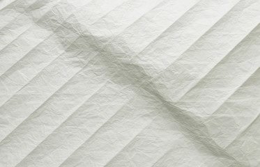 White and multicolored wrinkled paper surface, top view