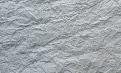 White and multicolored wrinkled paper surface, top view
