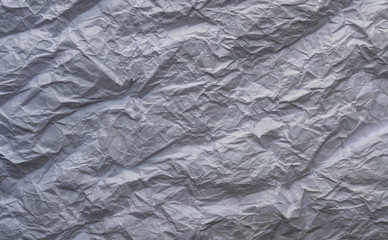 White and multicolored wrinkled paper surface, top view
