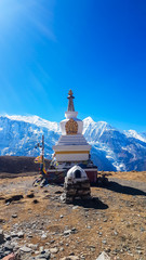 A stupa with Annapurna Chain as a backdrop, Annapurna Circuit Trek, Himalayas, Nepal. High...