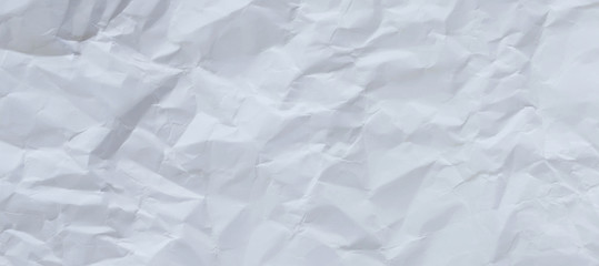 White and multicolored wrinkled paper surface, top view