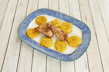 chicken pica garnished with plantain