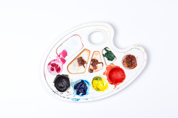 Creativity: paints and easel on white background. palett for watercolor