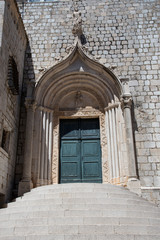 Fototapeta na wymiar Stone door and steps of a church in Dubrovnik, Croatia, Europe.