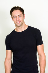 Fototapeta premium Portrait of happy young handsome man smiling