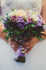 bride holding bouquet of flowers