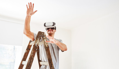 Man at virtual room design with VR glasses