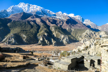 A temple complex in Manang Annapurna Circuit Trek, Nepal. Stupa in front of other buildings. Temple...