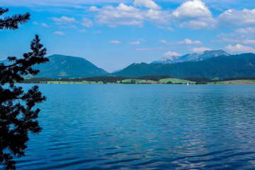 Beyond the lake, great hills, meadows and beautiful skies