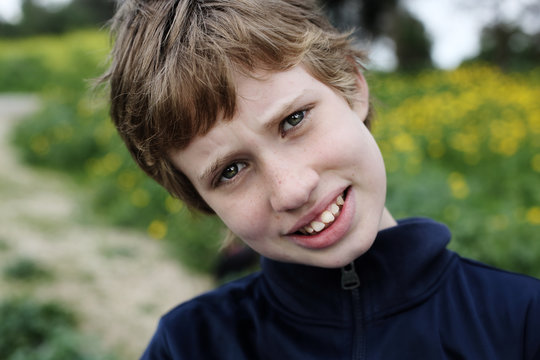 Life after coronavirus. Portrait of cute autistic boy enjoying of freedom.