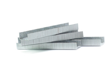 metal staple concept over white background
