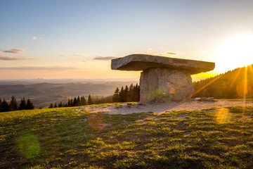 sunset over the stone altar with a beautiful view to the spring scenery