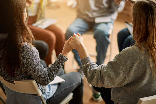 Cropped Club Members Sit In The Circle, Hold Hands Of Each Other, Pray For The Best, For Getting Rid Of Addicts, Help And Support