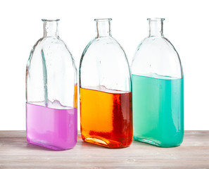 glass bottles with color watercolour solutions
