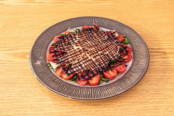 emiliana salad on wooden table